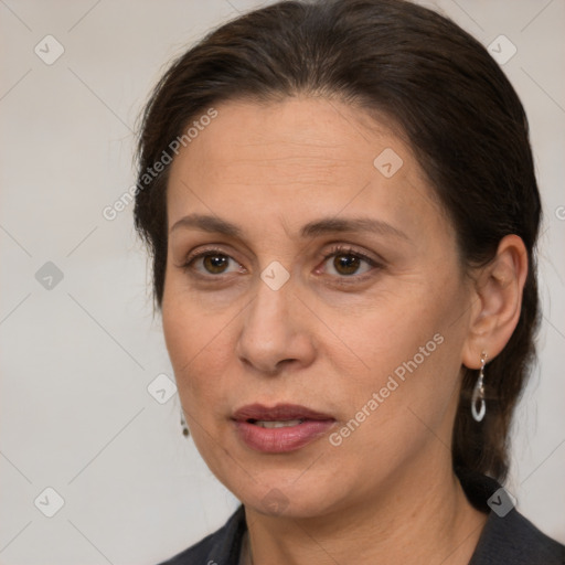 Joyful white adult female with medium  brown hair and brown eyes