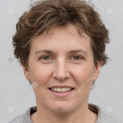 Joyful white adult female with short  brown hair and grey eyes