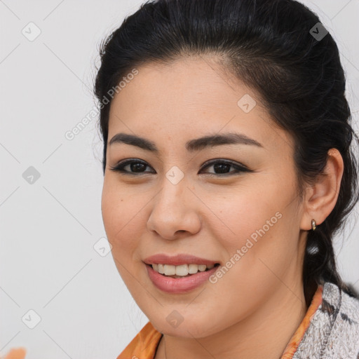 Joyful latino young-adult female with medium  brown hair and brown eyes