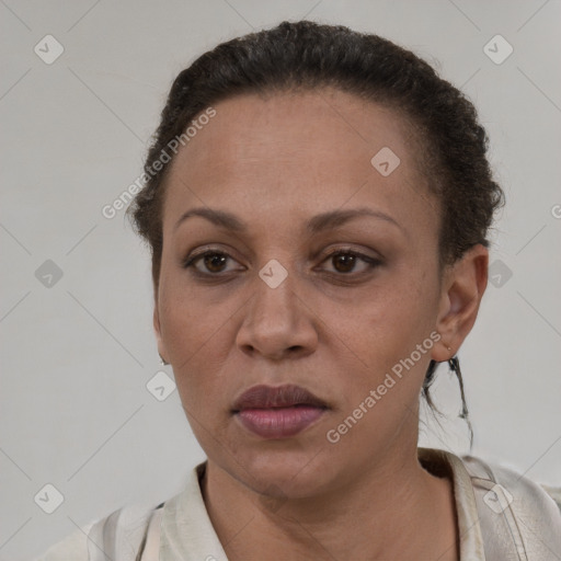 Joyful latino adult female with short  brown hair and brown eyes