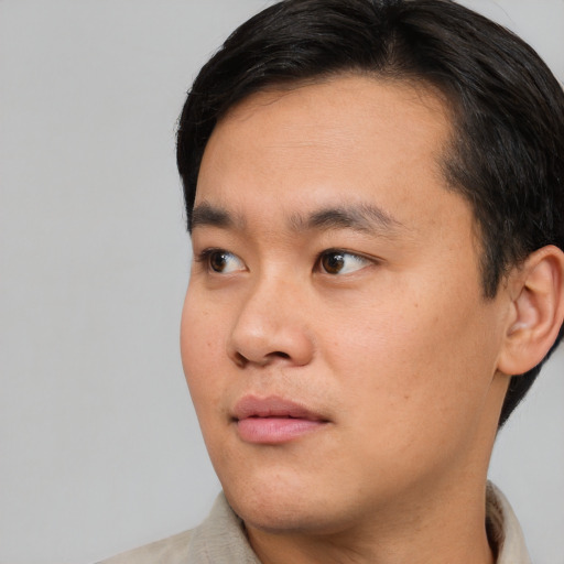 Neutral asian young-adult male with short  black hair and brown eyes