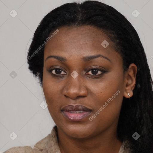 Joyful black young-adult female with long  black hair and brown eyes