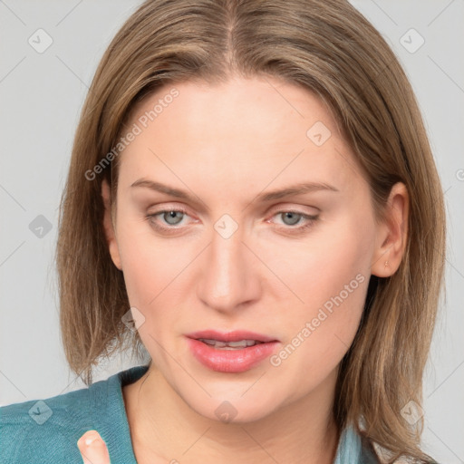 Joyful white young-adult female with medium  brown hair and blue eyes