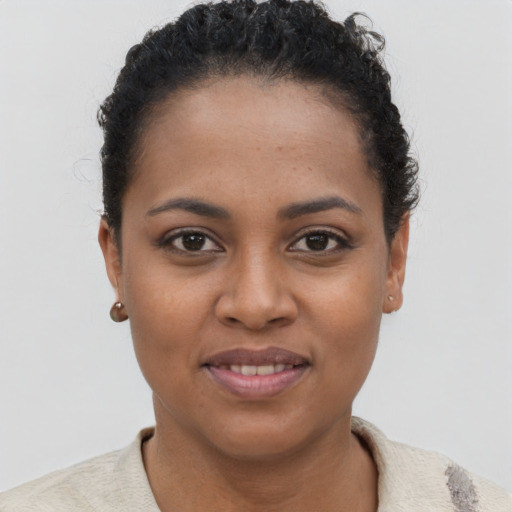 Joyful latino young-adult female with short  brown hair and brown eyes