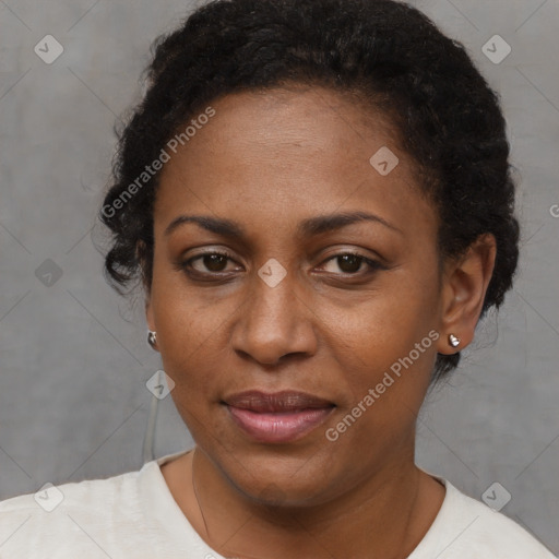 Joyful black adult female with short  brown hair and brown eyes