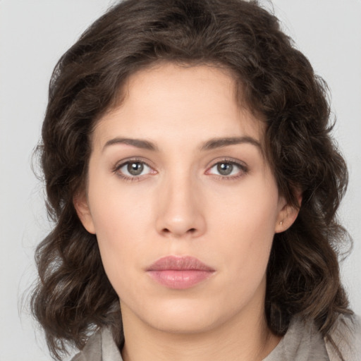 Neutral white young-adult female with medium  brown hair and brown eyes