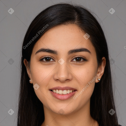 Joyful latino young-adult female with long  brown hair and brown eyes