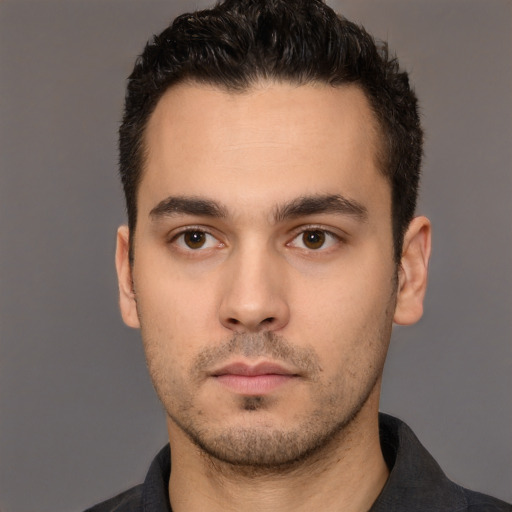 Neutral white young-adult male with short  black hair and brown eyes