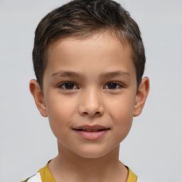 Joyful white child male with short  brown hair and brown eyes