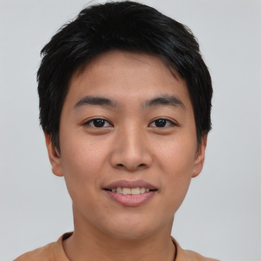 Joyful asian young-adult male with short  brown hair and brown eyes