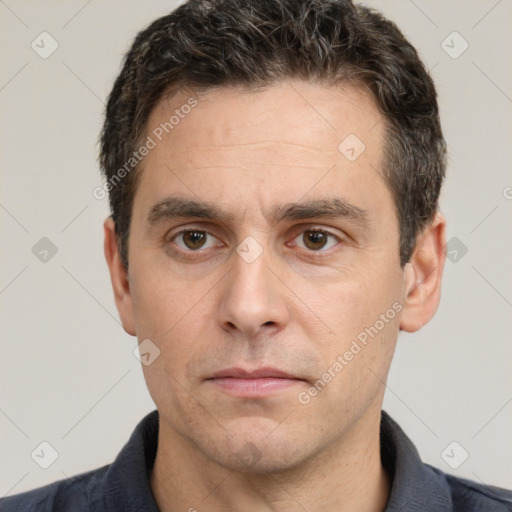 Neutral white adult male with short  black hair and brown eyes