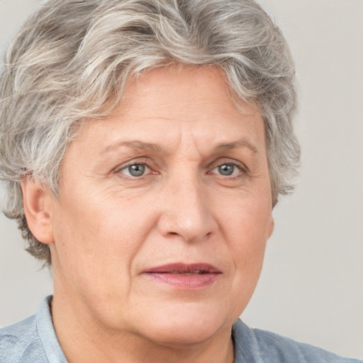 Joyful white middle-aged female with short  brown hair and grey eyes