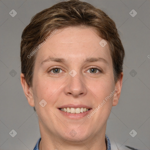 Joyful white adult female with short  brown hair and grey eyes