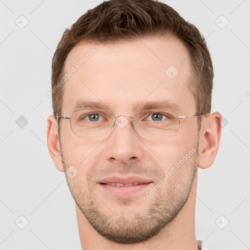 Joyful white adult male with short  brown hair and grey eyes