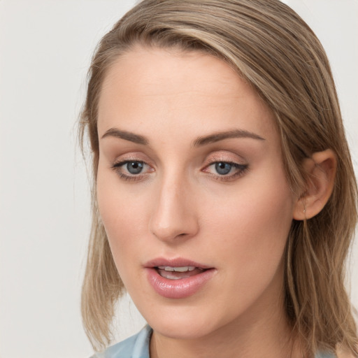 Neutral white young-adult female with long  brown hair and blue eyes