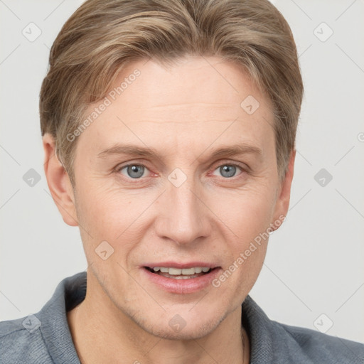 Joyful white adult female with short  brown hair and grey eyes