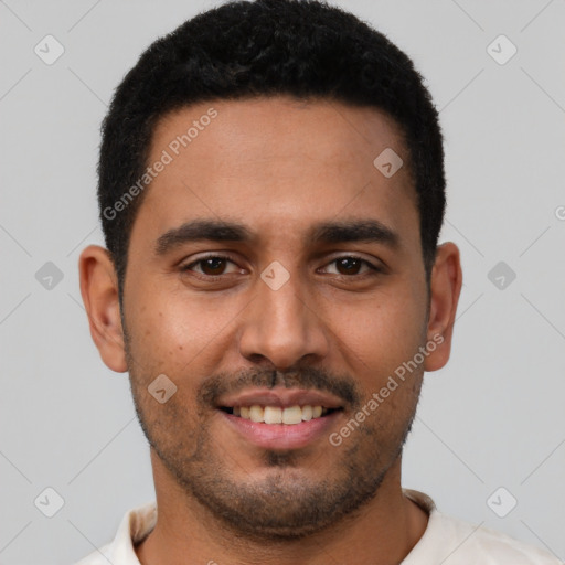 Joyful latino young-adult male with short  brown hair and brown eyes