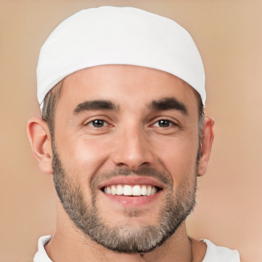 Joyful white young-adult male with short  black hair and brown eyes