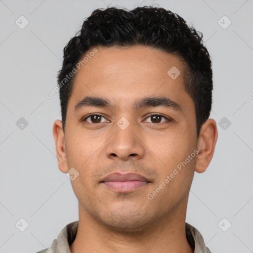 Neutral latino young-adult male with short  black hair and brown eyes