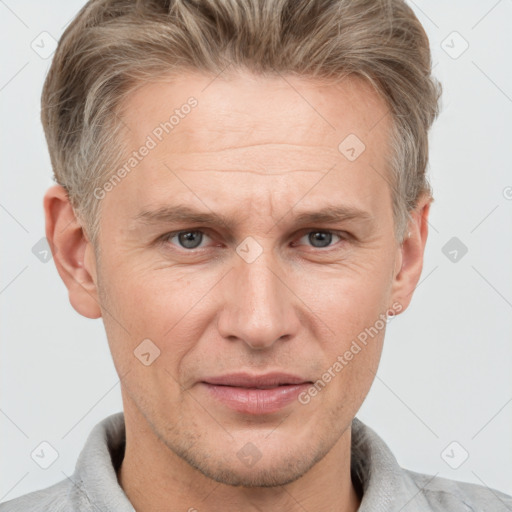 Joyful white adult male with short  brown hair and grey eyes