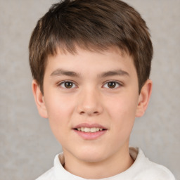 Joyful white child male with short  brown hair and brown eyes