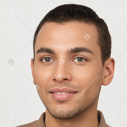 Joyful white young-adult male with short  brown hair and brown eyes