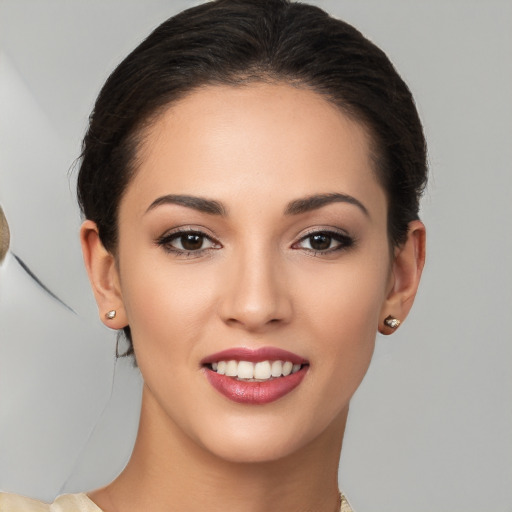 Joyful white young-adult female with medium  brown hair and brown eyes