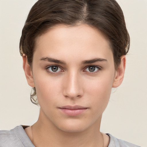 Neutral white young-adult female with short  brown hair and brown eyes