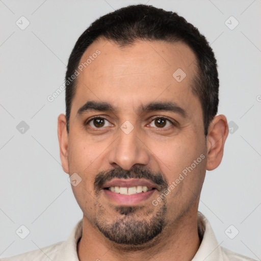 Joyful white young-adult male with short  black hair and brown eyes