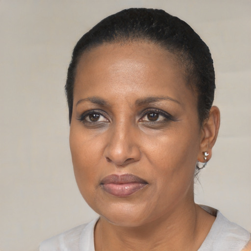 Neutral black adult female with short  black hair and brown eyes