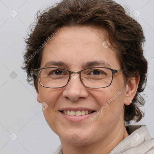 Joyful white adult female with short  brown hair and brown eyes