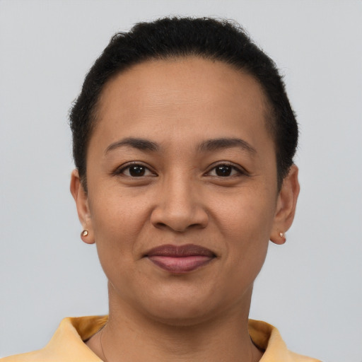 Joyful latino young-adult female with short  brown hair and brown eyes