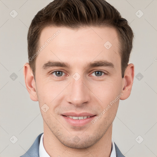 Joyful white young-adult male with short  brown hair and grey eyes