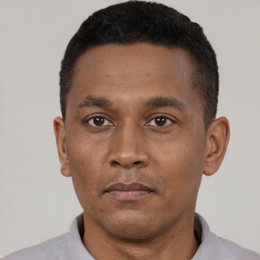 Neutral black young-adult male with short  black hair and brown eyes