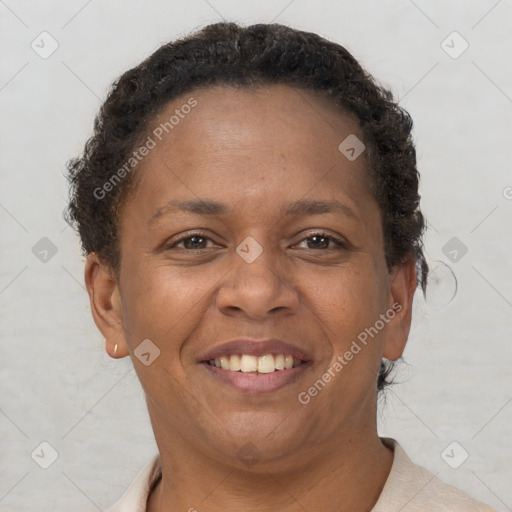 Joyful black adult female with short  brown hair and brown eyes