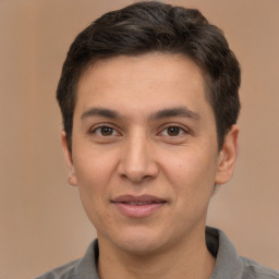 Joyful white adult male with short  brown hair and brown eyes