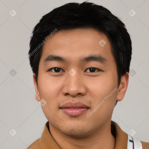 Joyful asian young-adult male with short  black hair and brown eyes