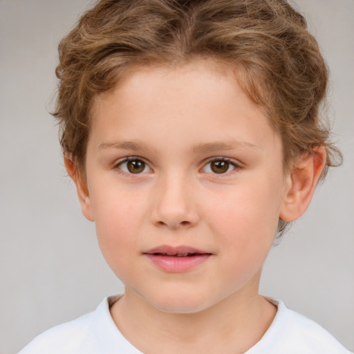 Joyful white child female with short  brown hair and brown eyes