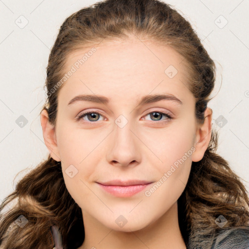 Joyful white young-adult female with long  brown hair and blue eyes