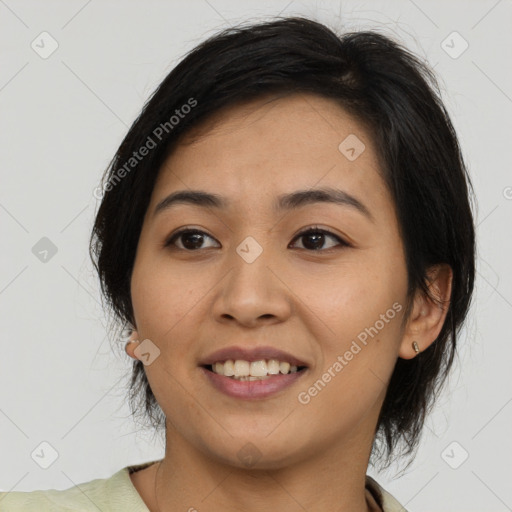 Joyful asian young-adult female with medium  black hair and brown eyes