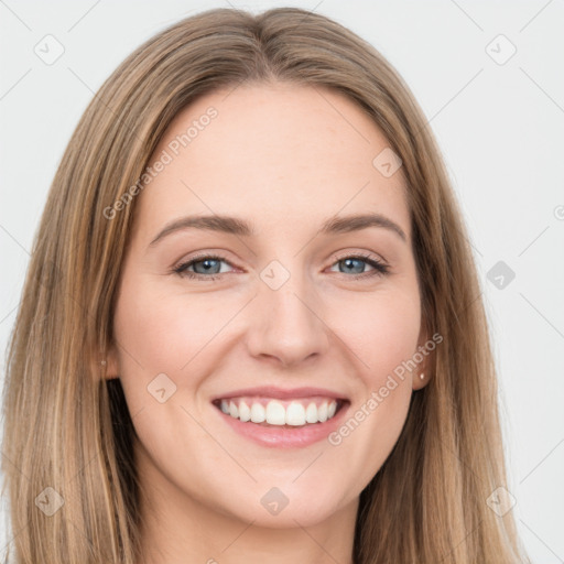 Joyful white young-adult female with long  brown hair and grey eyes