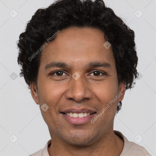 Joyful white adult male with short  black hair and brown eyes