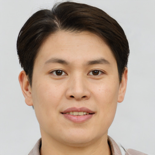 Joyful asian young-adult male with short  brown hair and brown eyes