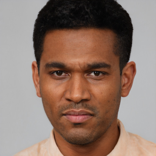 Neutral latino young-adult male with short  black hair and brown eyes