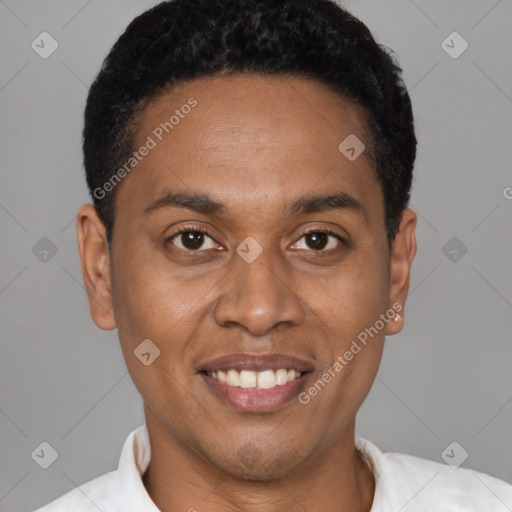 Joyful latino young-adult male with short  black hair and brown eyes