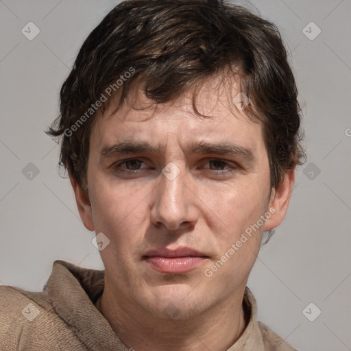 Joyful white adult male with short  brown hair and grey eyes