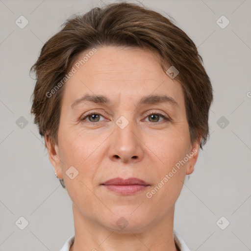 Joyful white adult female with short  brown hair and brown eyes