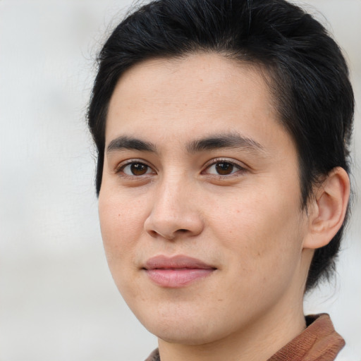 Joyful asian young-adult male with short  brown hair and brown eyes