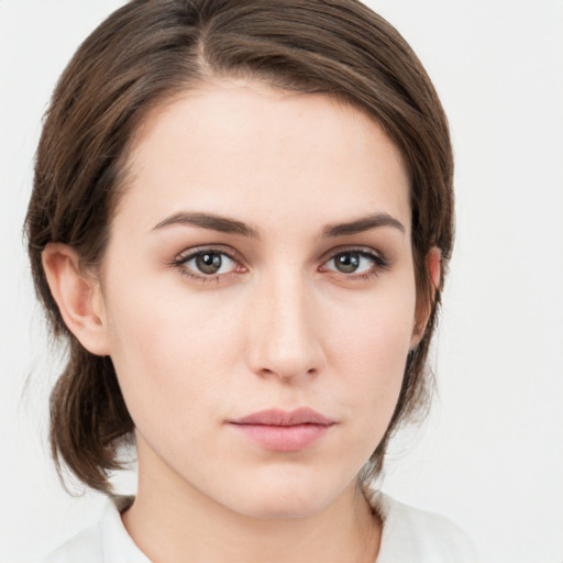 Neutral white young-adult female with medium  brown hair and grey eyes