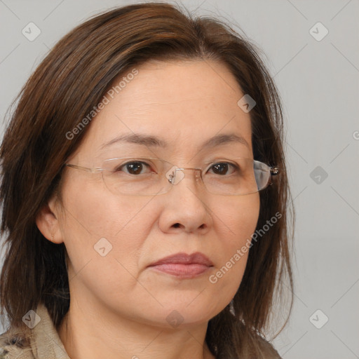 Joyful white adult female with medium  brown hair and brown eyes